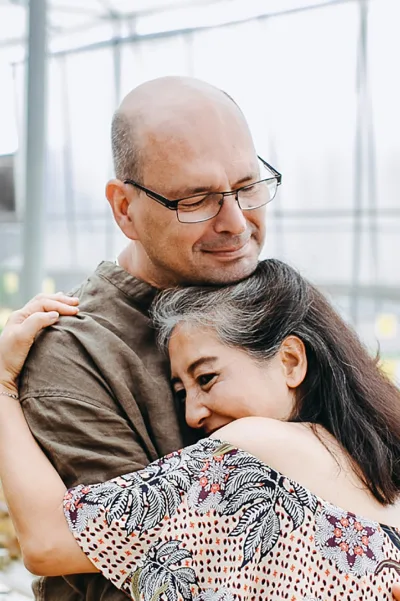 An older couple embracing